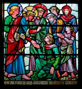 A stained glass window depicting Jesus curing the leper, Church of Christ the Consoler, Skelton Cum Newby, North Yorkshire